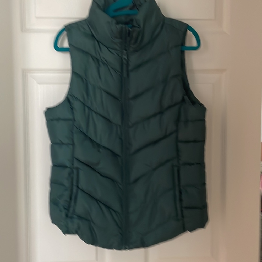 Dark green sleeveless vest